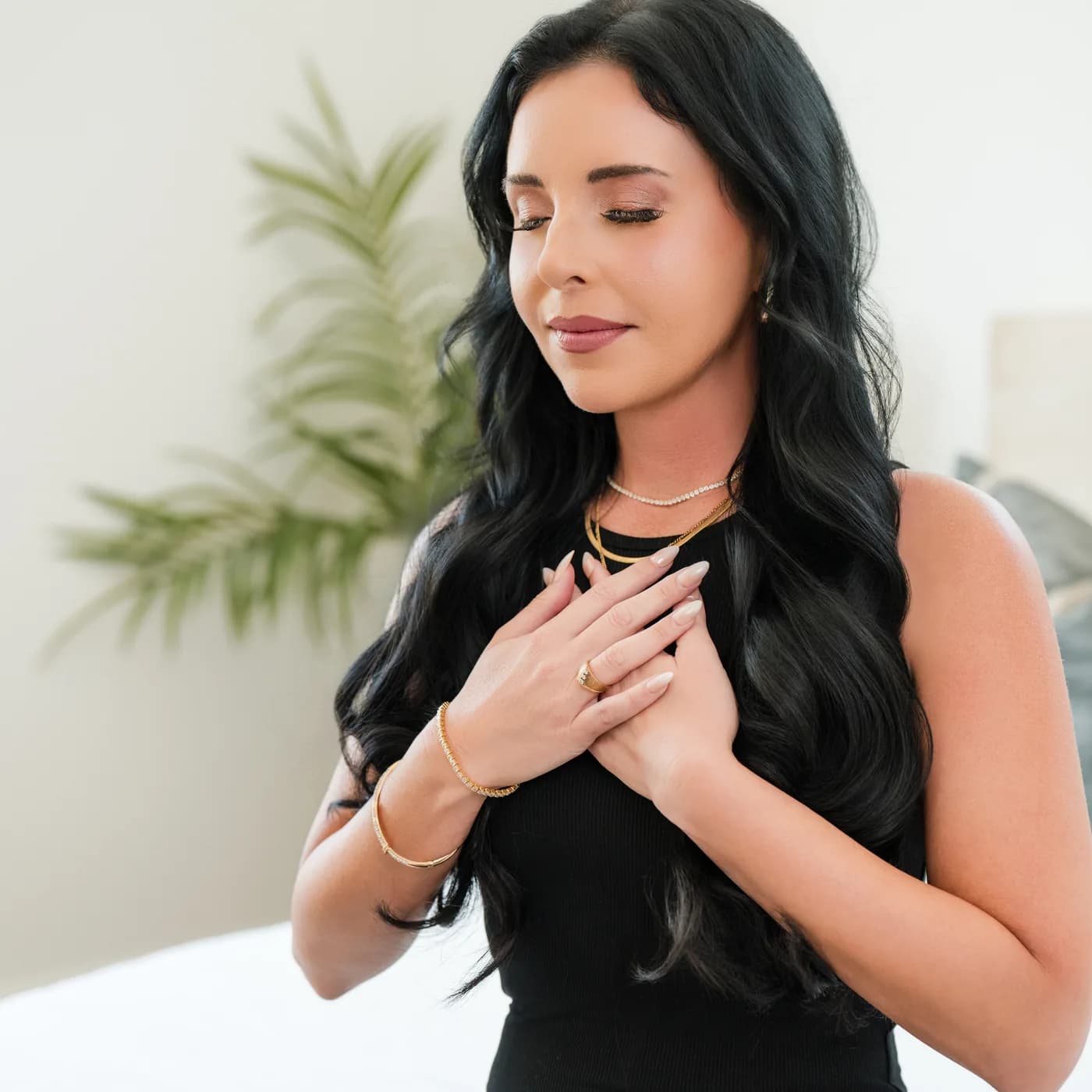 Danielle Laura with her hands on her heart